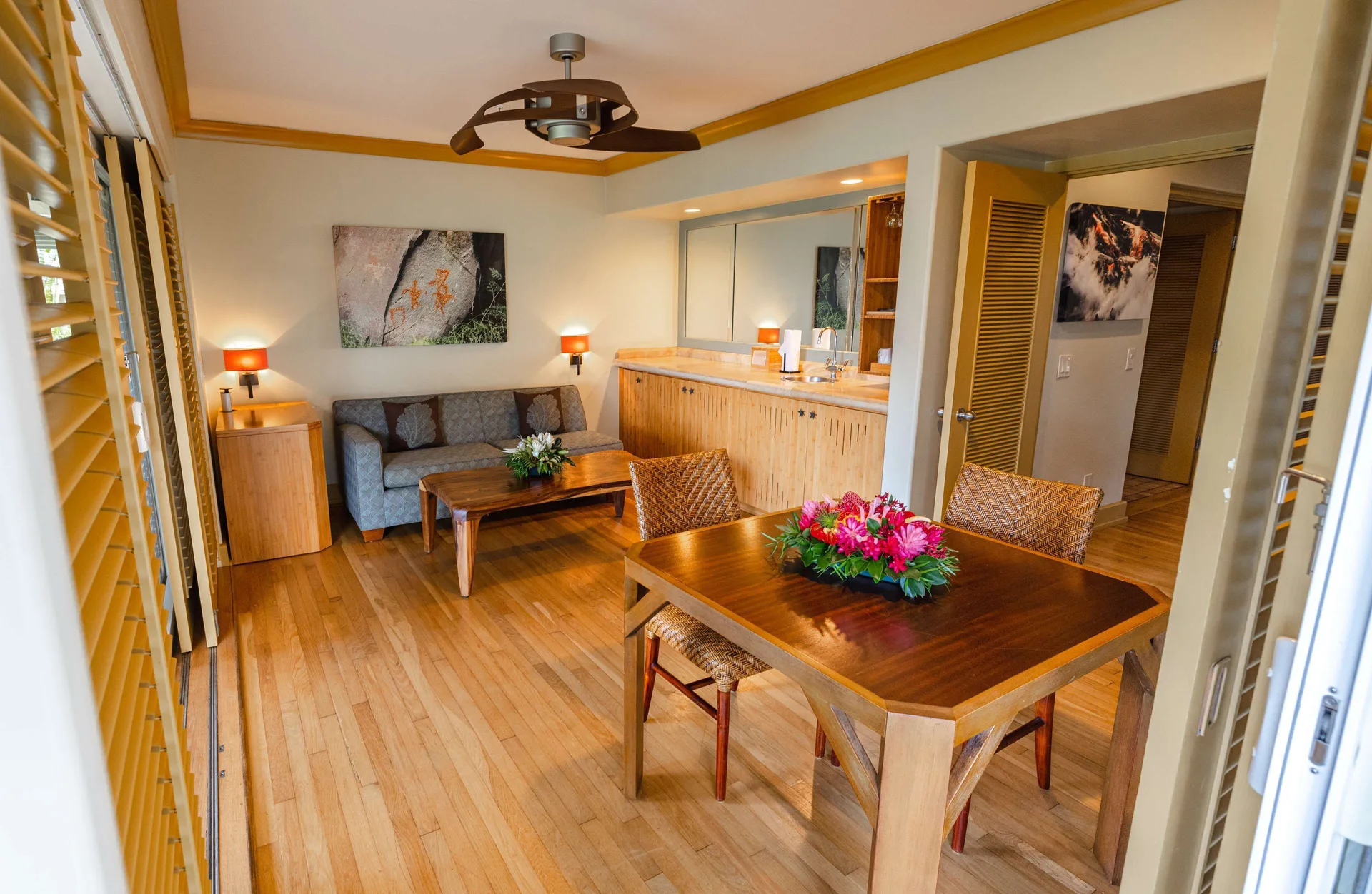 Garden View Suite living and dining area with wood floors at Hana-Maui Resort.