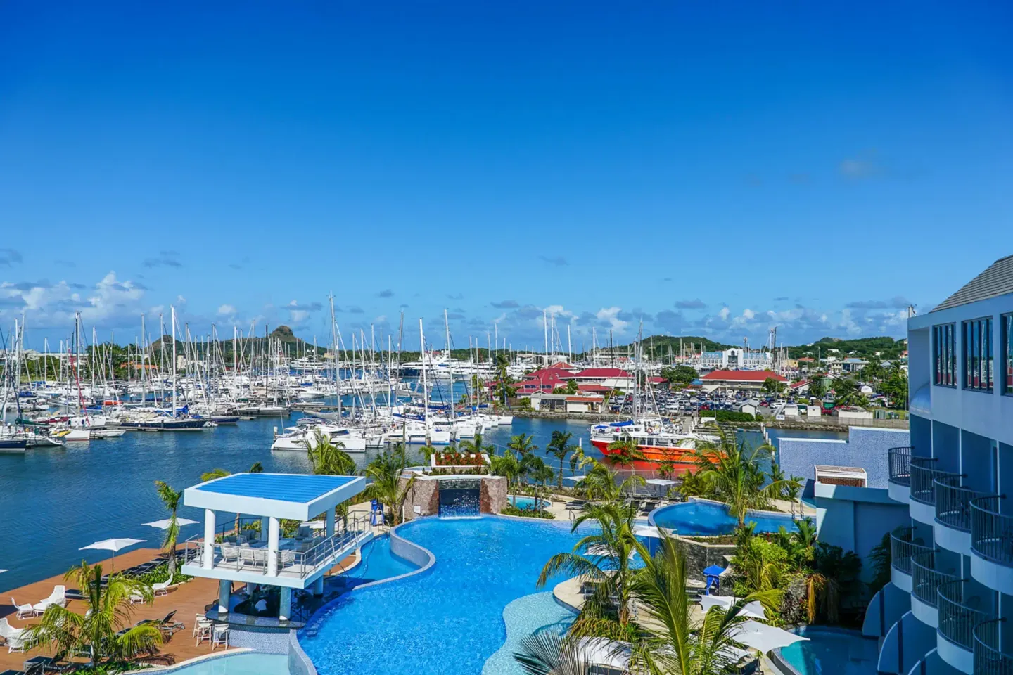 Pool area overlooking the marina and sailboats at Harbor Club St. Lucia.