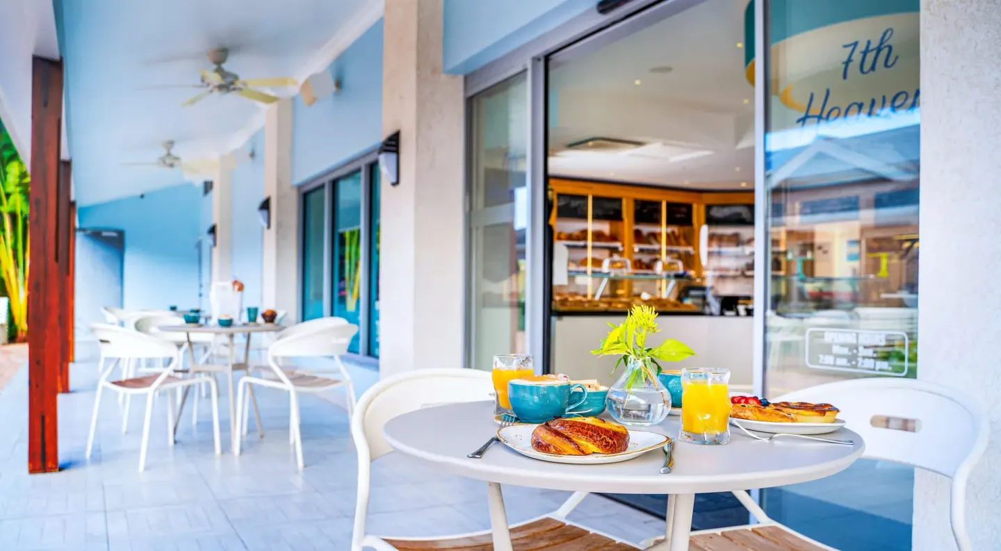 Bakery patio table with pastries and drinks at Harbor Club St. Lucia.