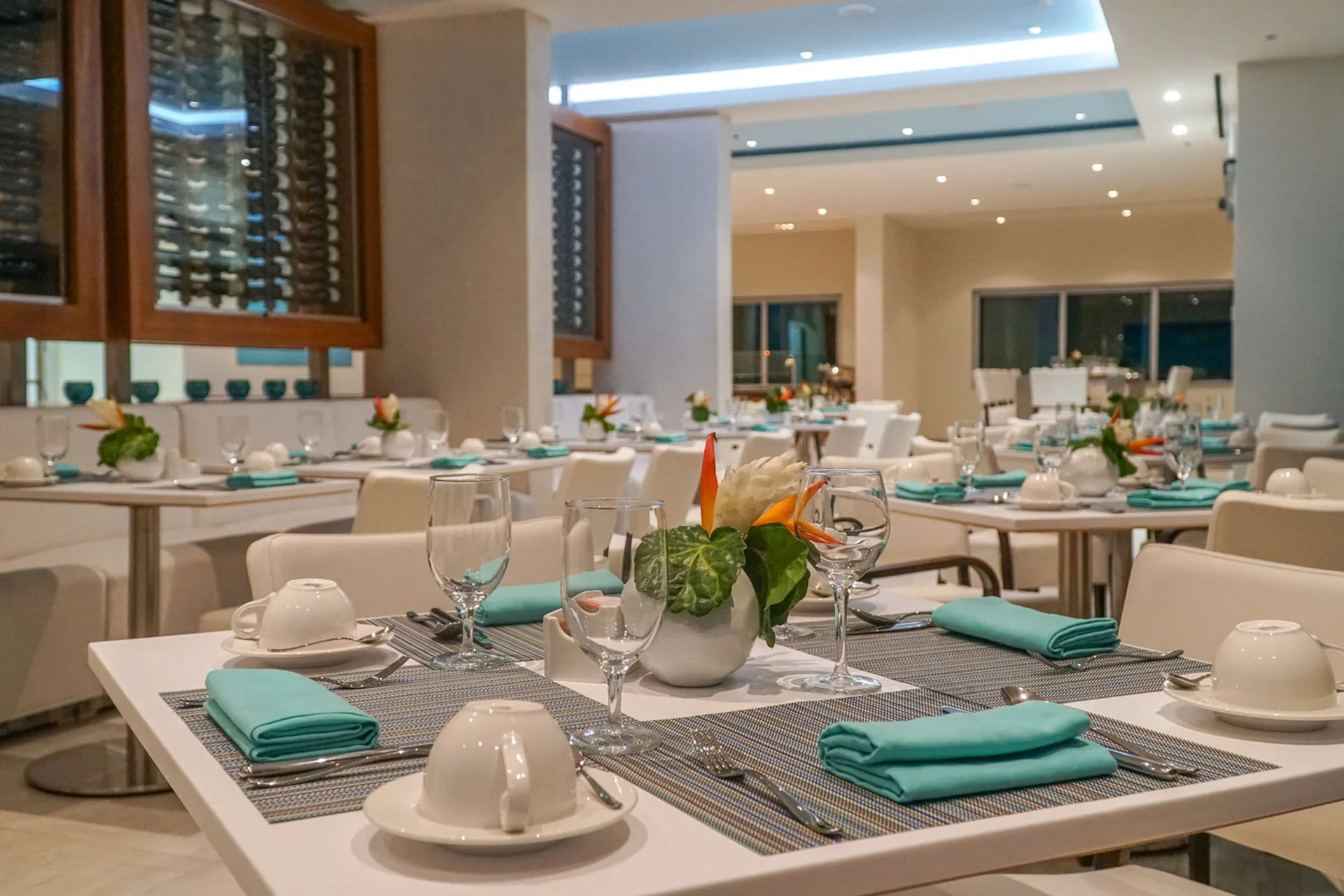 Breakfast dining room with turquoise napkins at Harbor Club St. Lucia.