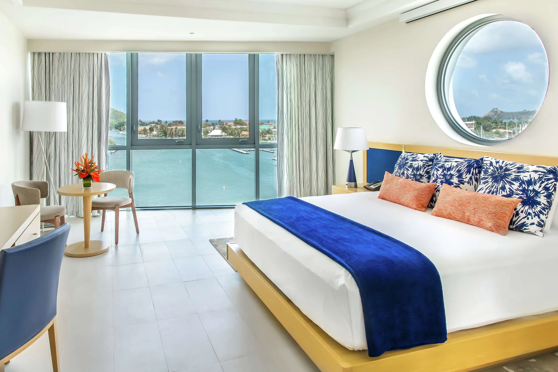 Corner Harbor Club St. Lucia with king bed and marina view at Harbor Club St. Lucia.