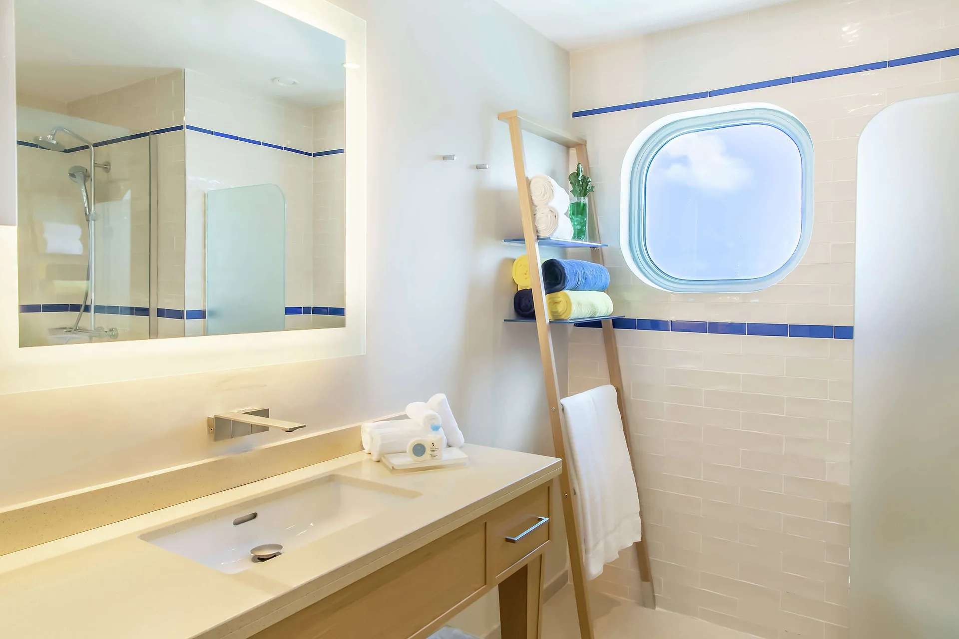 Corner Harbor Club St. Lucia room bathroom with vanity and shower at Harbor Club St. Lucia.