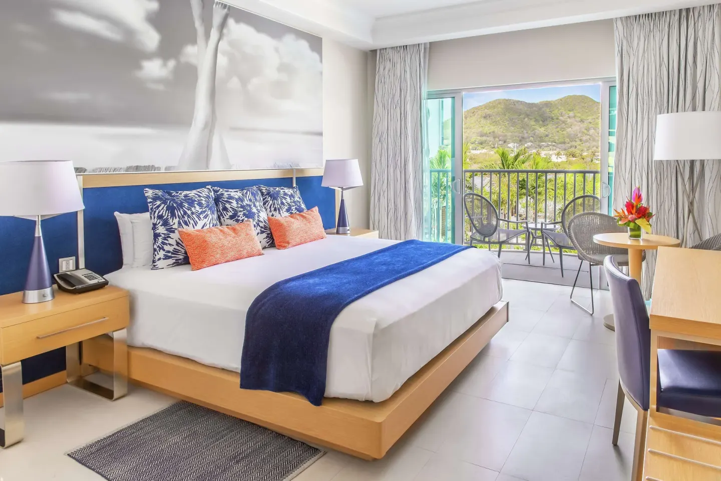 King room with balcony and mountain view at Harbor Club St. Lucia.