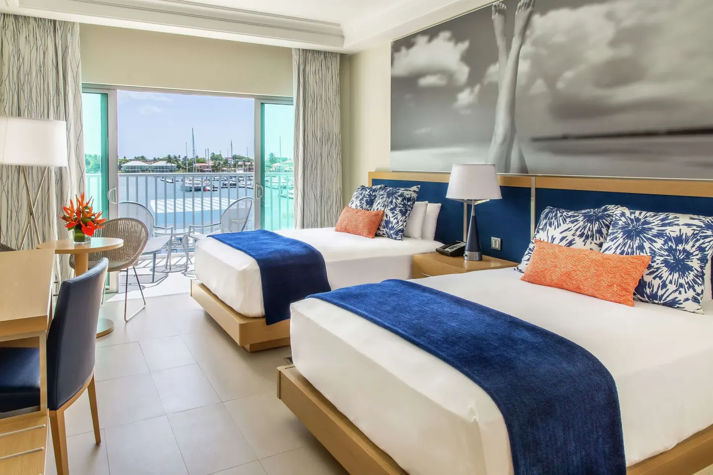 Two-bed guest room with marina-facing balcony at Harbor Club St. Lucia.