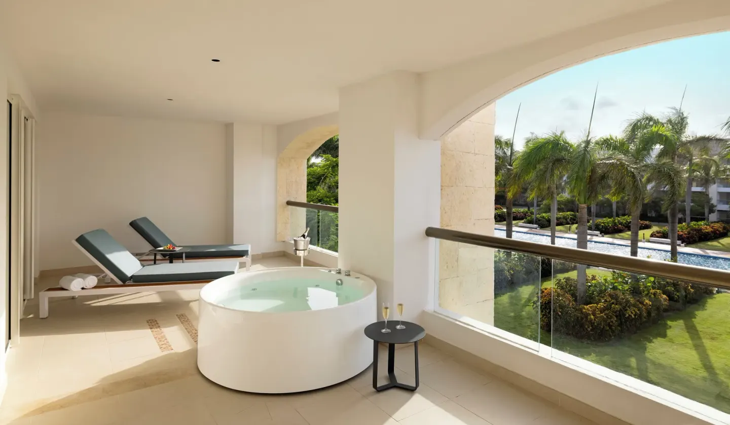 Balcony terrace with soaking tub and loungers at Hard Rock Hotel & Casino Punta Cana.