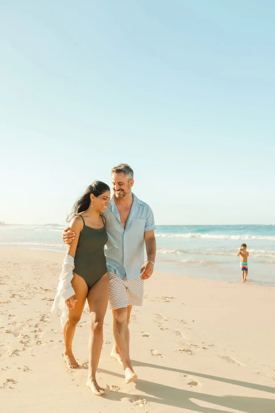 Couple walking on the beach at Hard Rock Hotel & Casino Punta Cana.
