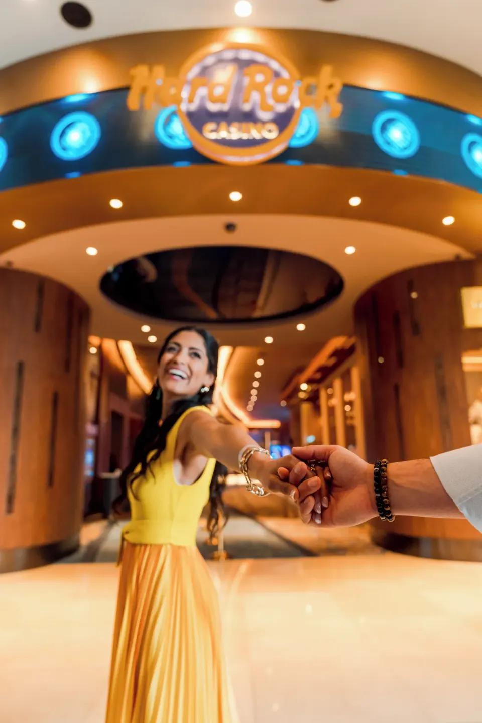 Guests walk toward the casino entrance at Hard Rock Hotel & Casino Punta Cana.