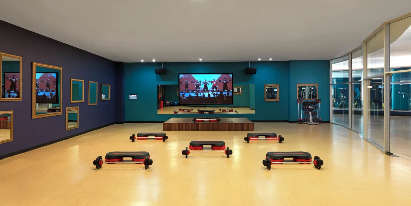 Group exercise studio with step platforms at Hard Rock Hotel & Casino Punta Cana.