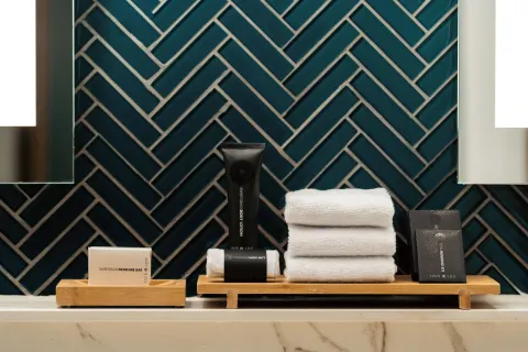 Bath amenities and folded towels on a vanity at Hard Rock Hotel & Casino Punta Cana.