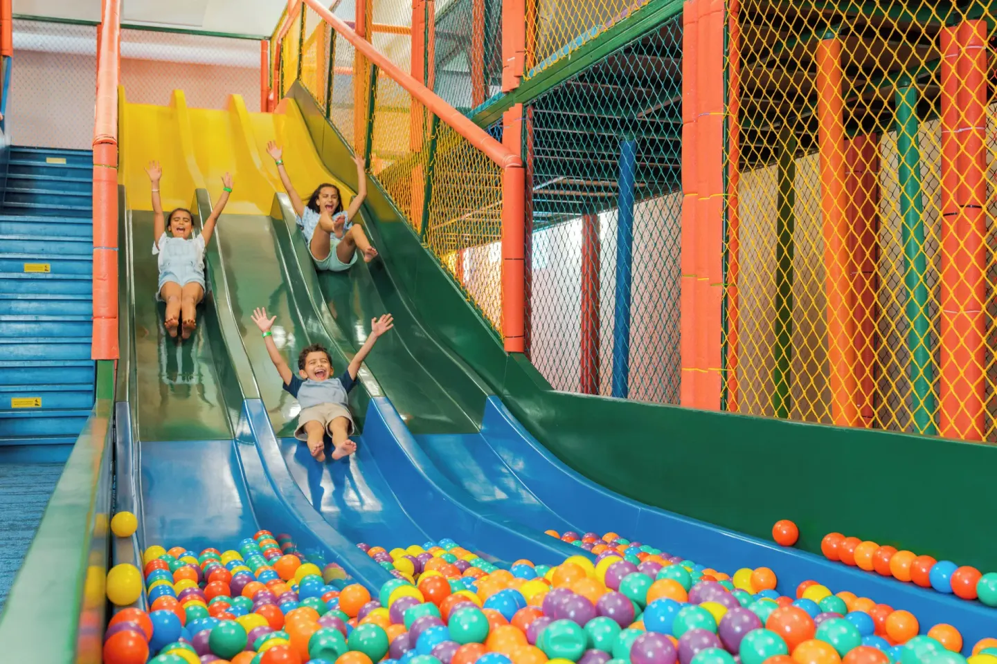 Children slide into a ball pit in the kids play area at Hard Rock Hotel & Casino Punta Cana.