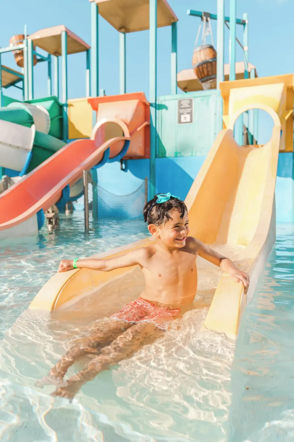 Child on a water slide in the kids pool at Hard Rock Hotel & Casino Punta Cana.
