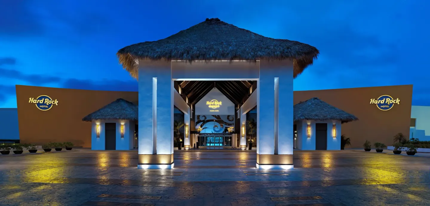 Illuminated resort entrance at dusk at Hard Rock Hotel & Casino Punta Cana.