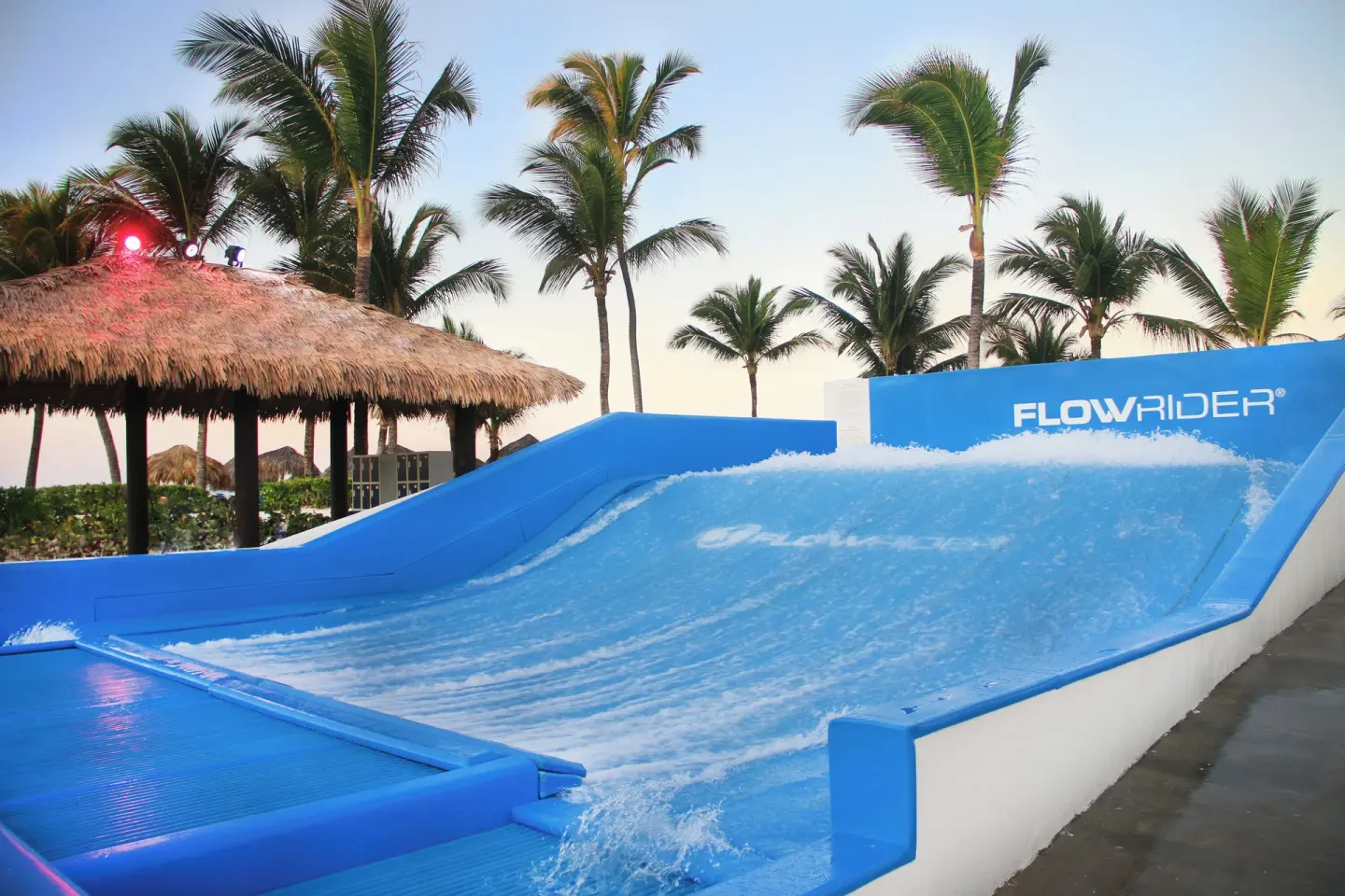 Surf simulator with flowing water and palm trees at Hard Rock Hotel & Casino Punta Cana.