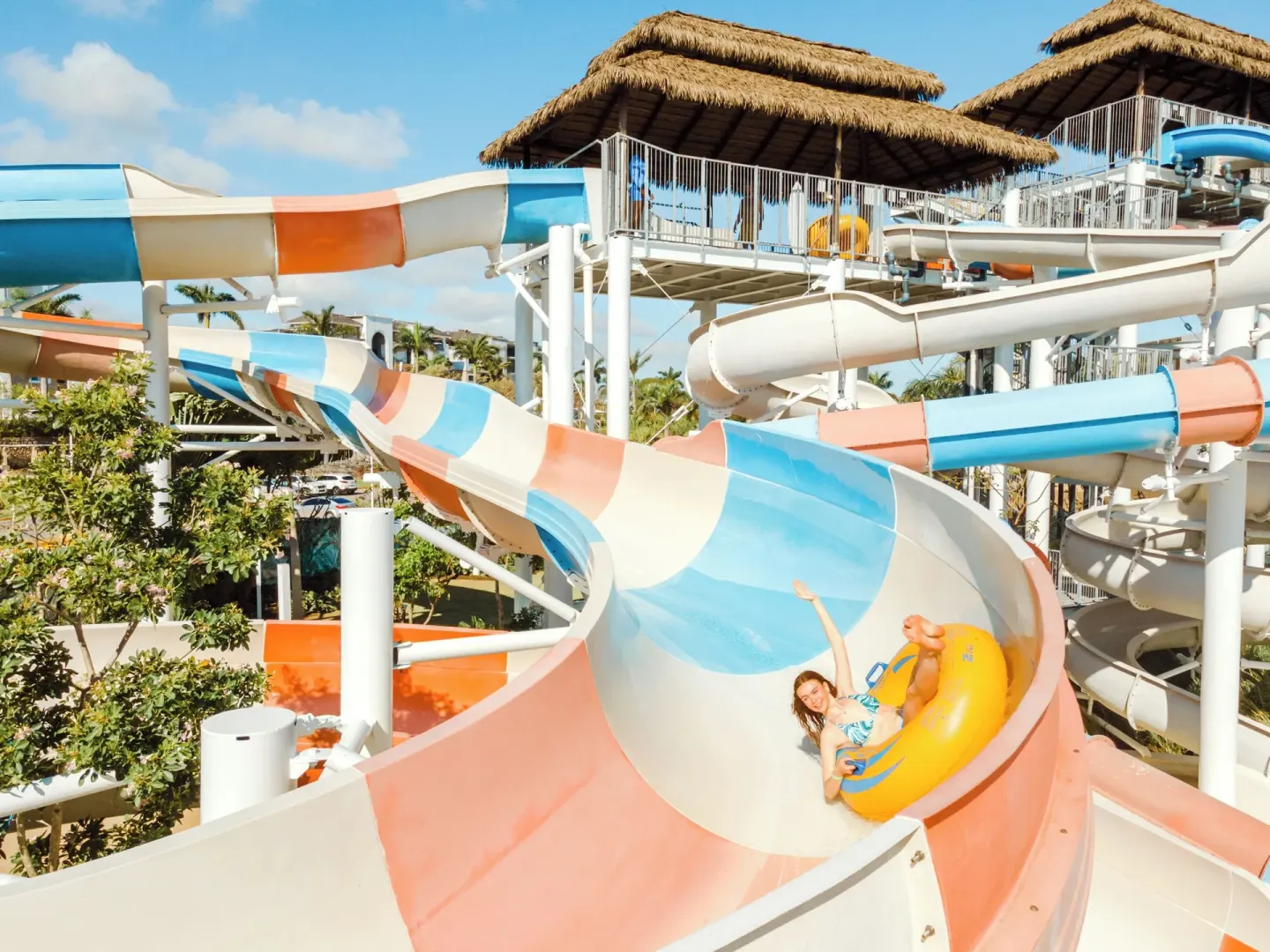 Guest riding a tube on a large water slide at Hard Rock Hotel & Casino Punta Cana.