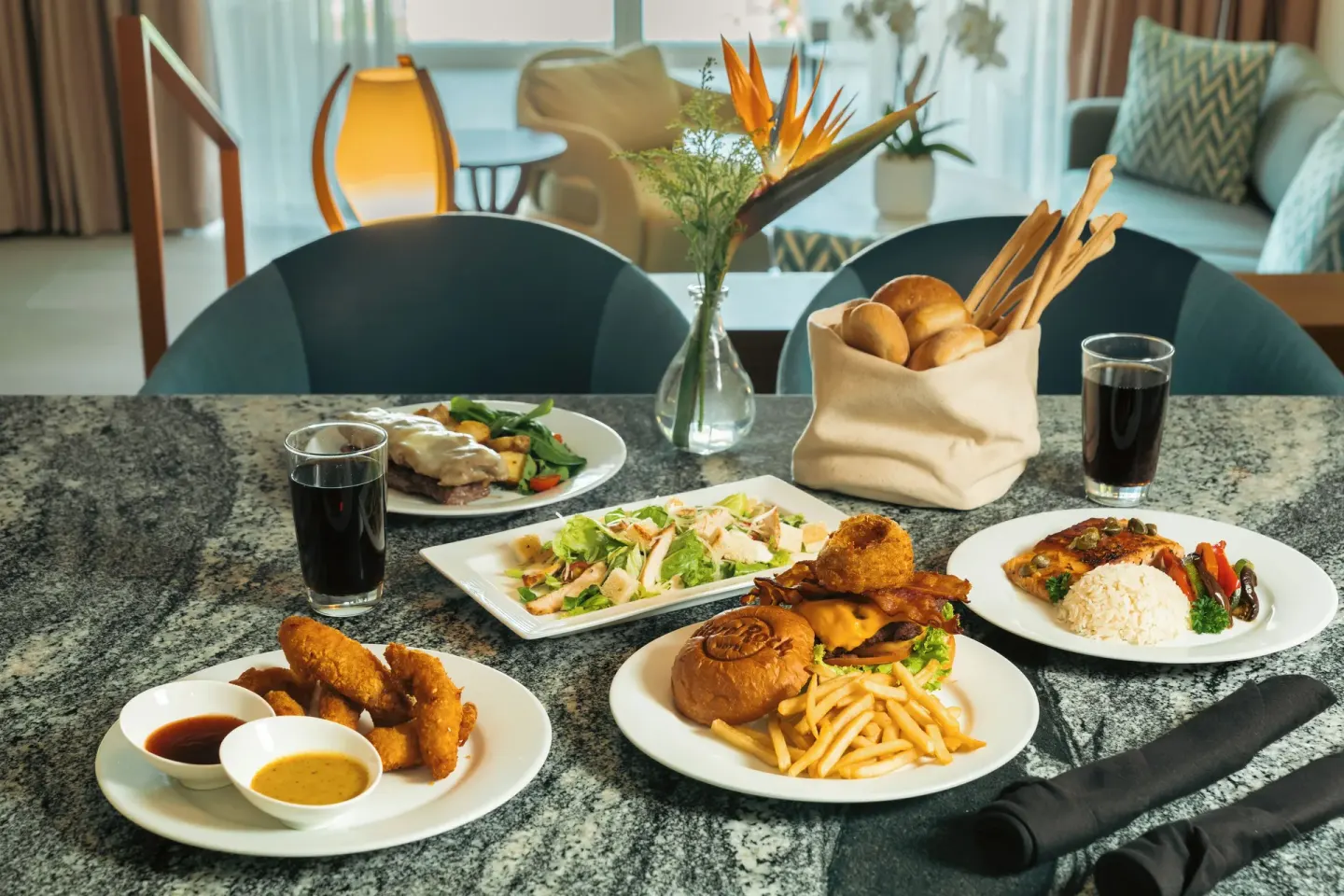 Assorted plated room-service meal on a table at Hard Rock Hotel & Casino Punta Cana.
