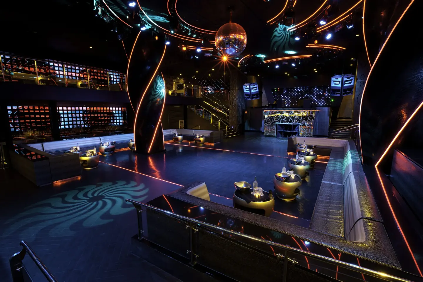 Oro Nightclub dance floor at Hard Rock Hotel & Casino Punta Cana with neon lines and a disco ball.