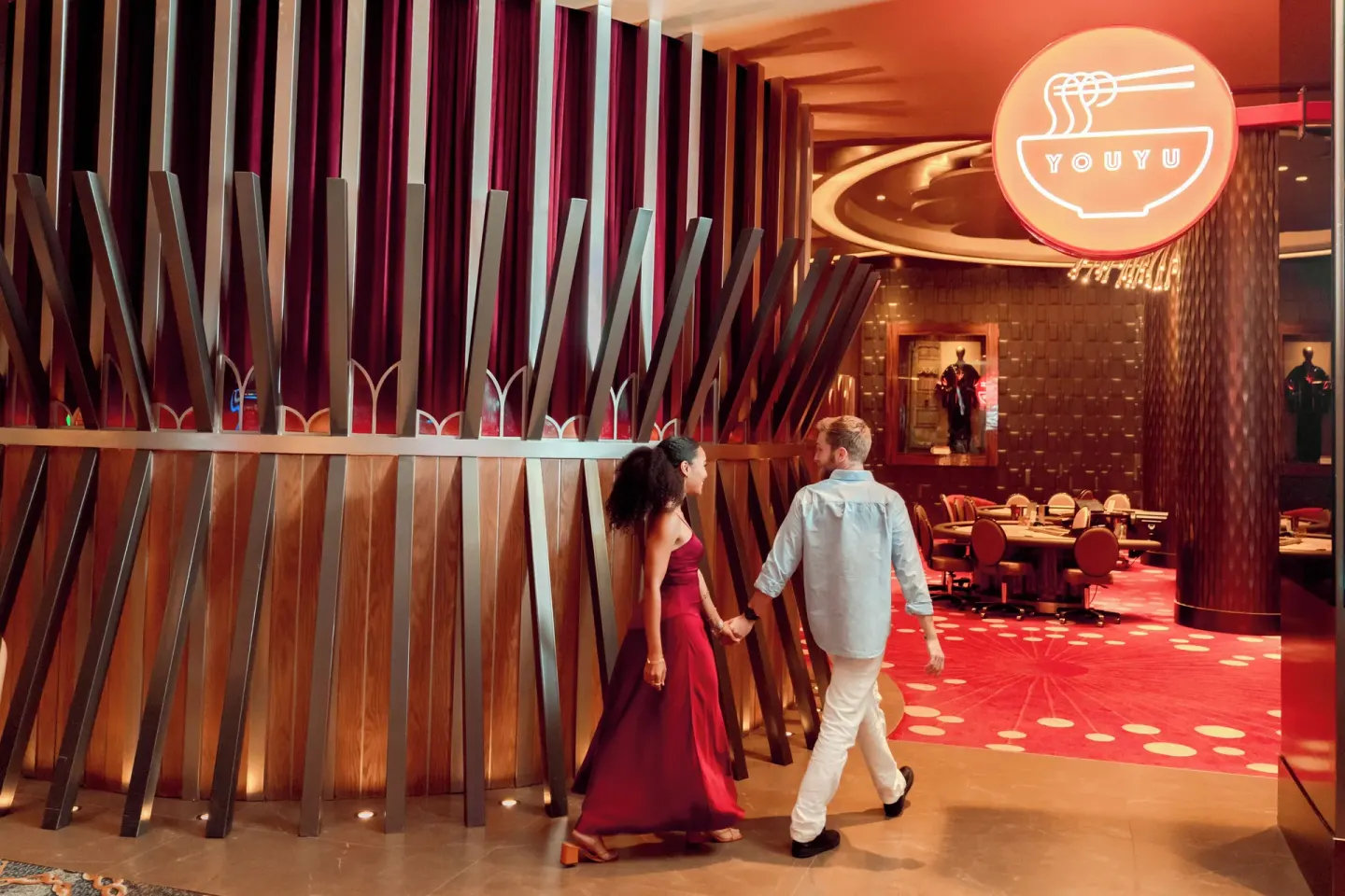 Youyu restaurant entrance at Hard Rock Hotel & Casino Punta Cana with red lighting and a noodle-bowl sign.