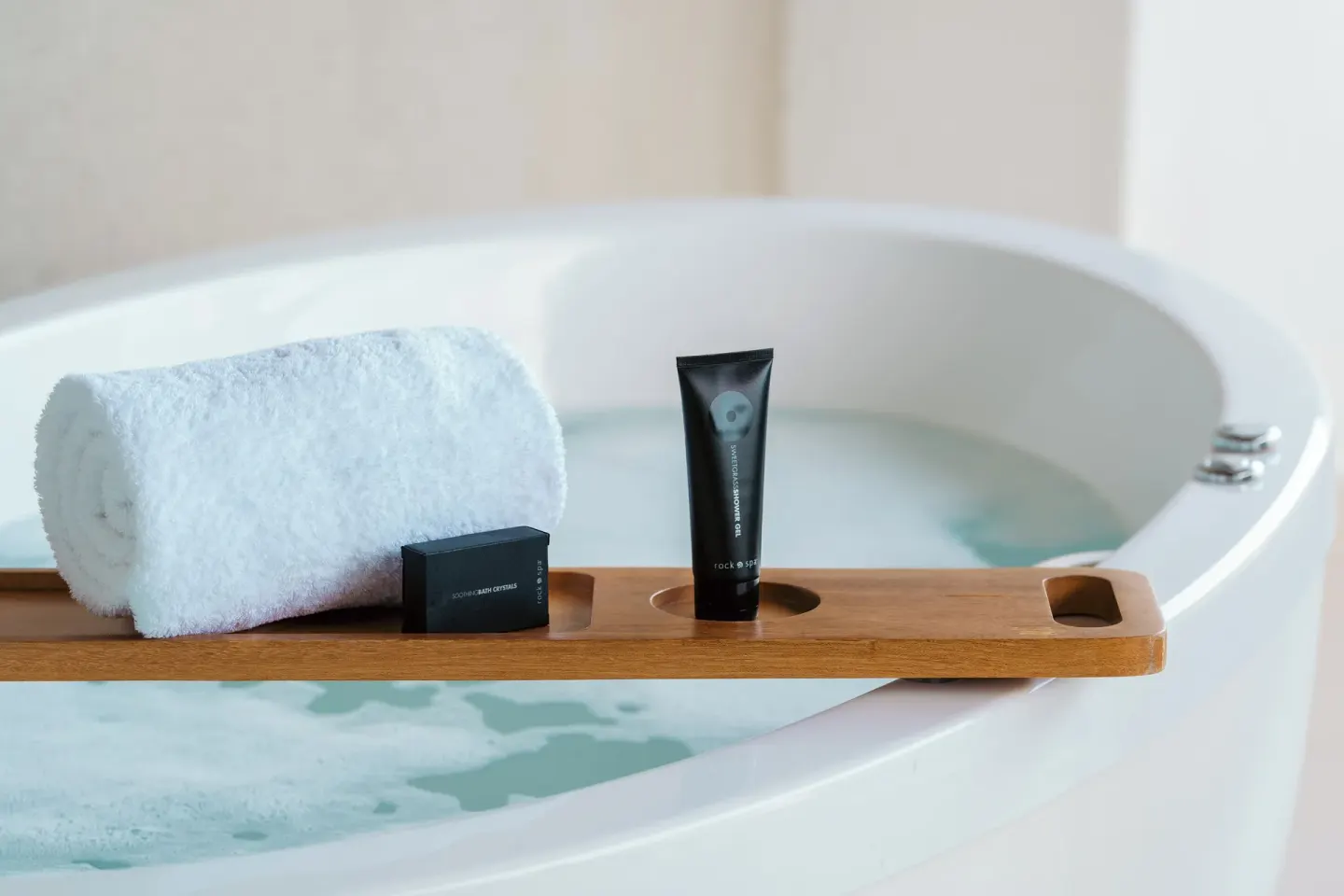 Suite soaking tub with towel and bath amenities at Hard Rock Hotel & Casino Punta Cana.