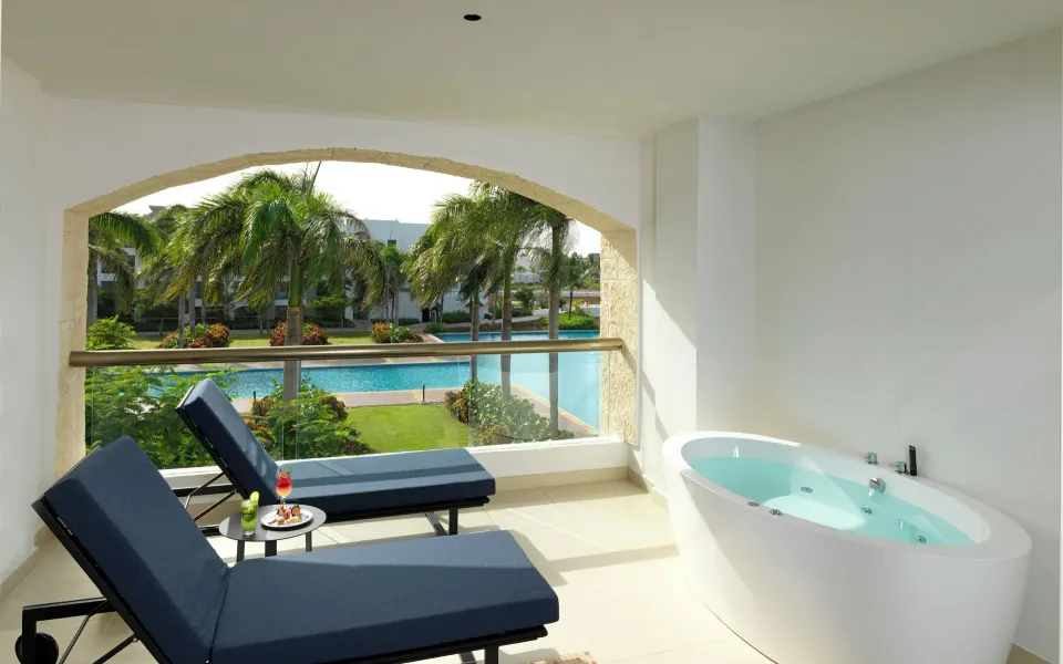Terrace with loungers and soaking tub at Hard Rock Hotel & Casino Punta Cana.