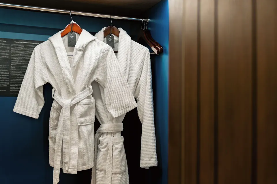 White robes hanging in the Rock Family Suite closet at Hard Rock Hotel & Casino Punta Cana.