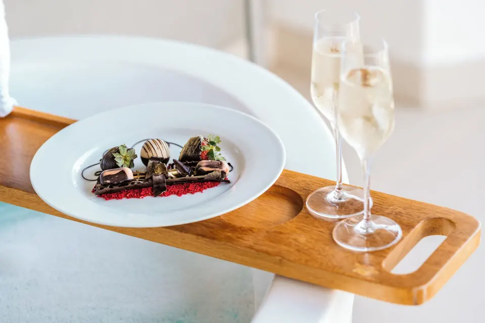 Rock Royalty Caribbean Sand Suite bathtub tray with dessert at Hard Rock Hotel & Casino Punta Cana.