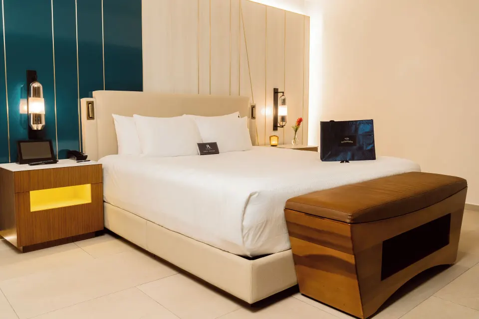 Rock Royalty Caribbean Sand Suite king bed and bench at Hard Rock Hotel & Casino Punta Cana.