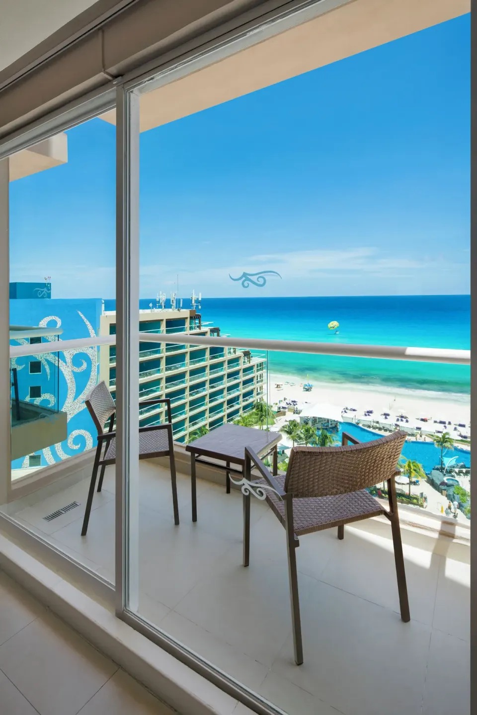 Balcony chairs with beach and ocean view at Hard Rock Hotel Cancun.