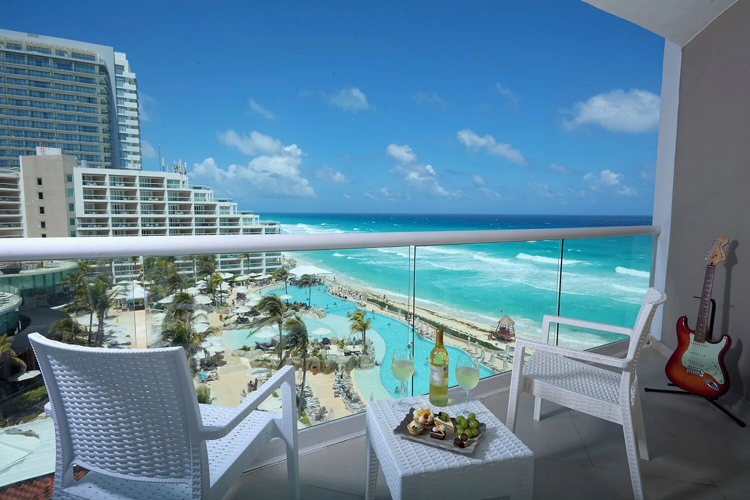 Balcony seating with guitar and ocean view at Hard Rock Hotel Cancun.