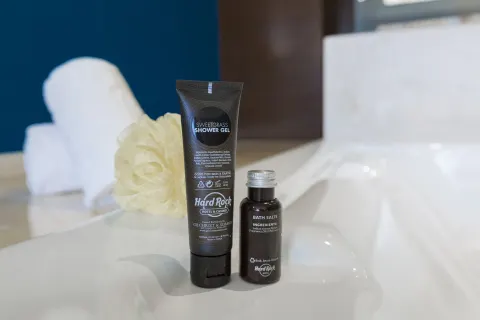 Bath amenities beside a white tub at Hard Rock Hotel Cancun.