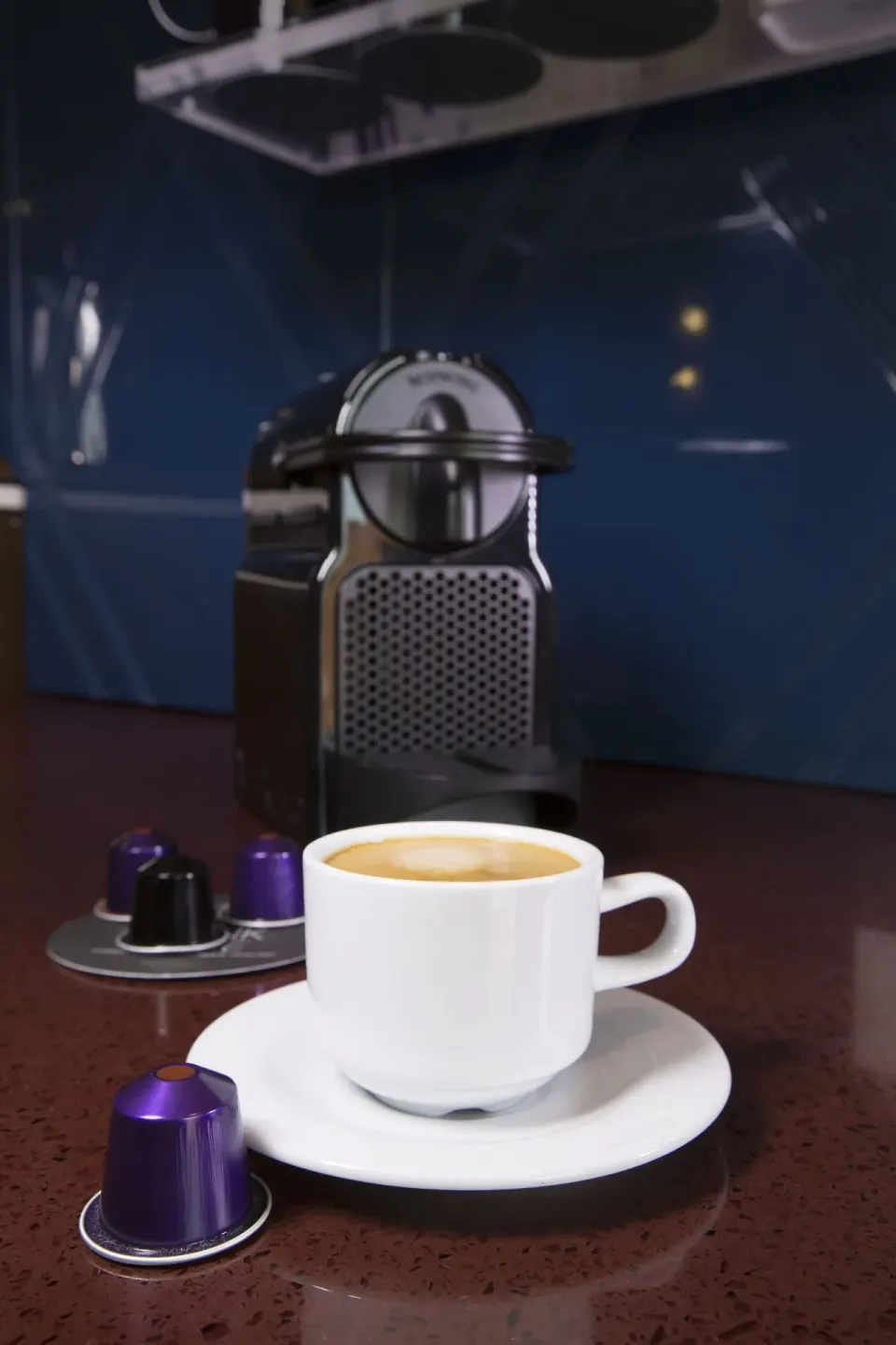 Coffee cup and capsule machine on a counter at Hard Rock Hotel Cancun.