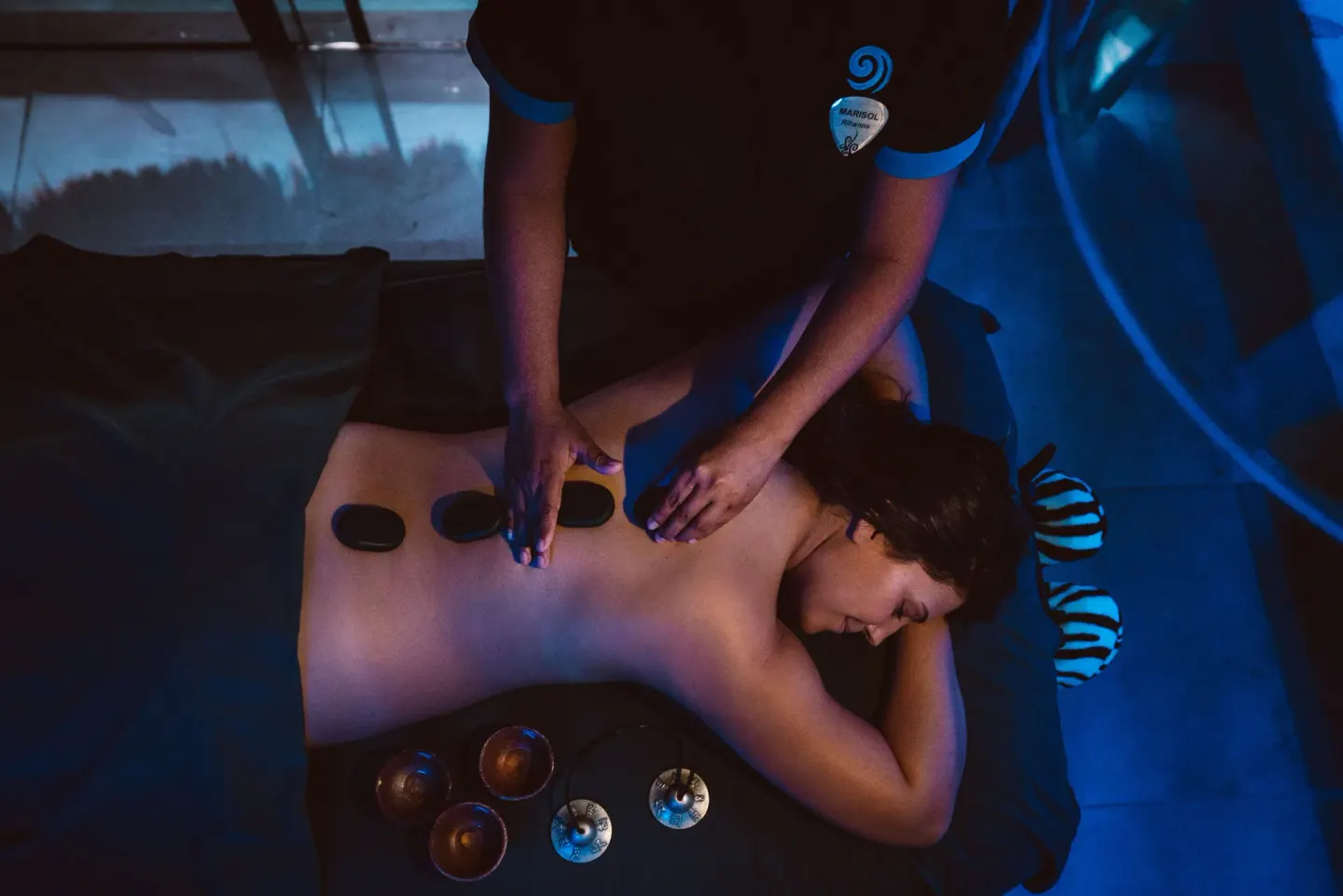 A guest receives a hot stone massage at Hard Rock Hotel Cancun.