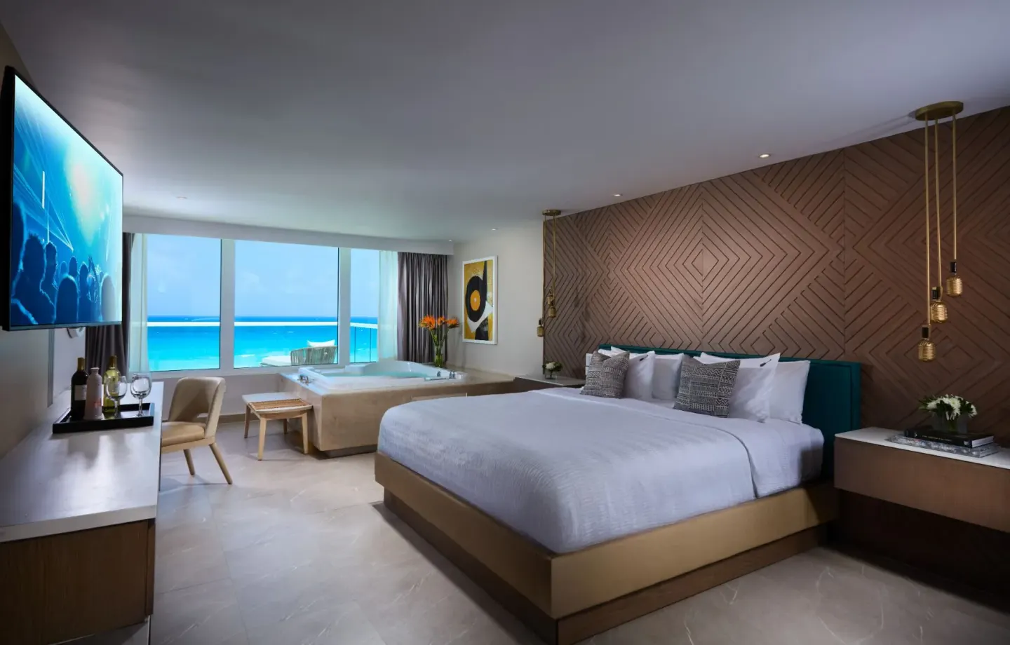 Ocean-view king bed guest room with a soaking tub at Hard Rock Hotel Cancun.