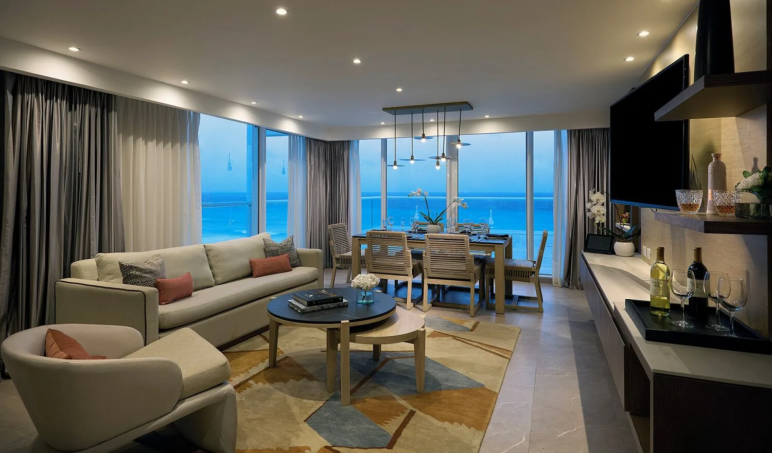 Oceanfront suite living and dining area at Hard Rock Hotel Cancun.