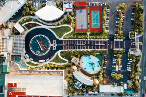 Overhead view of pools, courts, paths, and parking at Hard Rock Hotel Cancun.