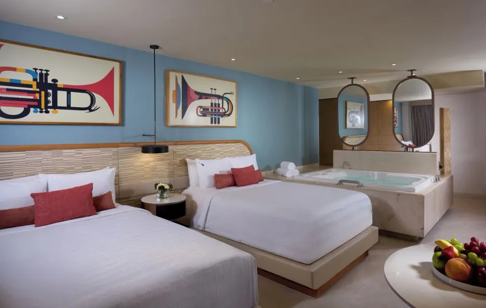 Deluxe Family Room Two Bedroom with two beds and a soaking tub at Hard Rock Hotel Cancun.