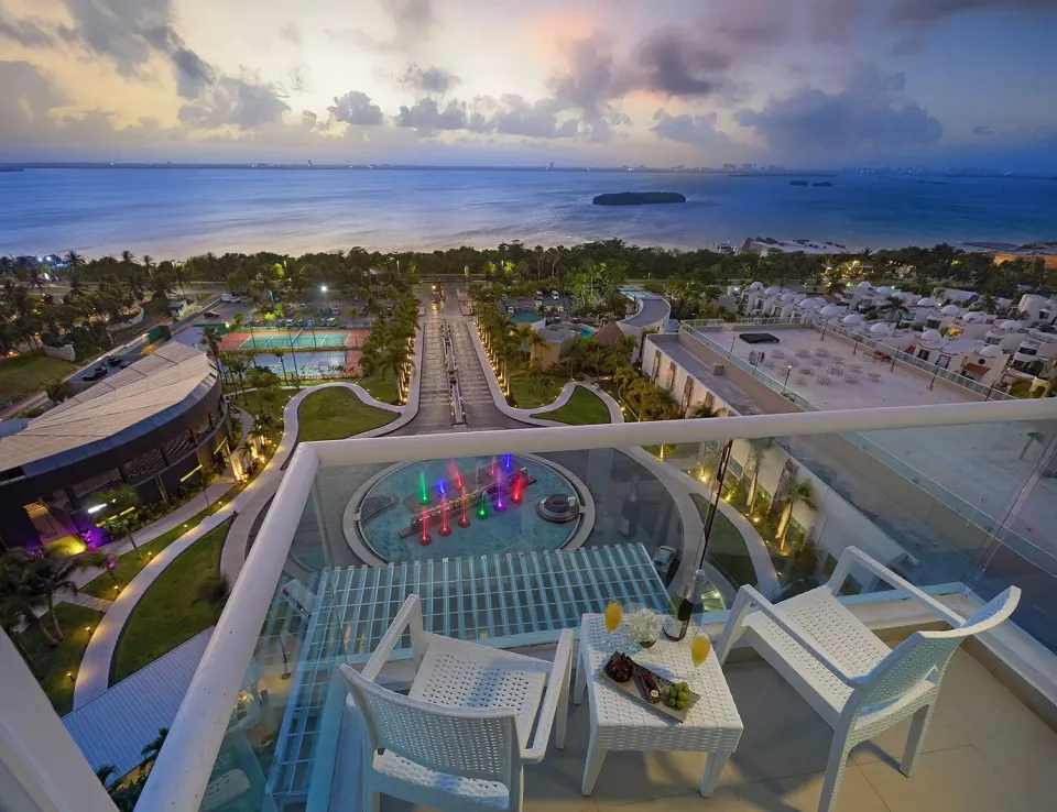 Deluxe Lagoon View balcony with chairs overlooking the lagoon at Hard Rock Hotel Cancun.