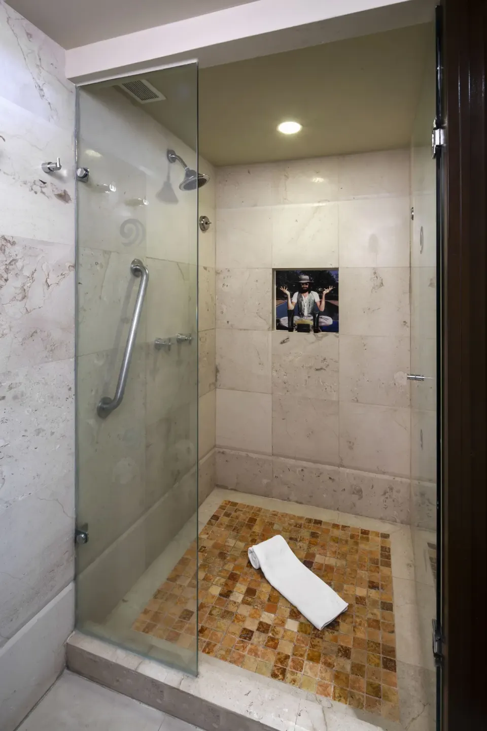 Deluxe Lagoon View bathroom shower with glass door at Hard Rock Hotel Cancun.
