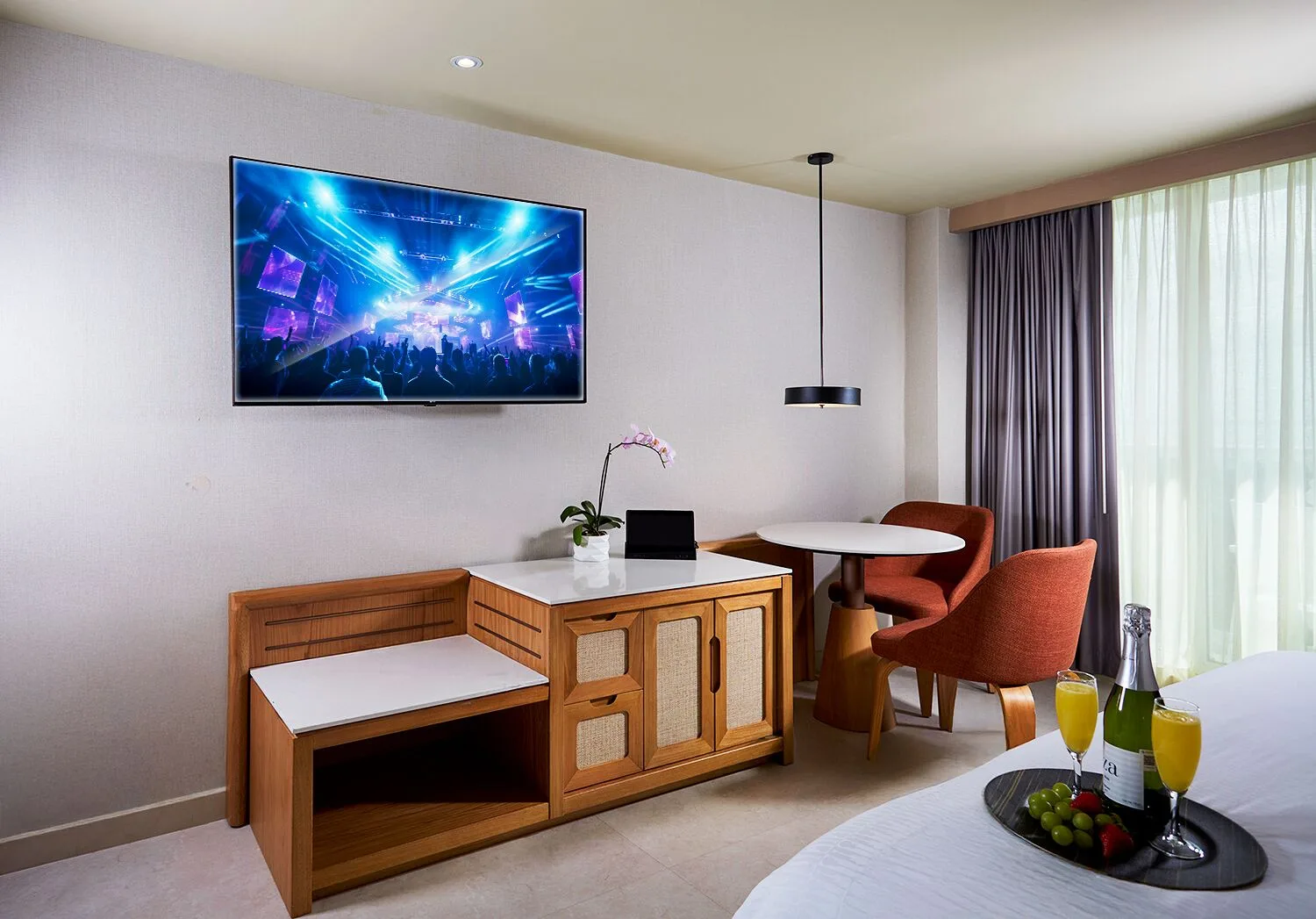 Deluxe Lagoon View room sitting area and bed at Hard Rock Hotel Cancun.