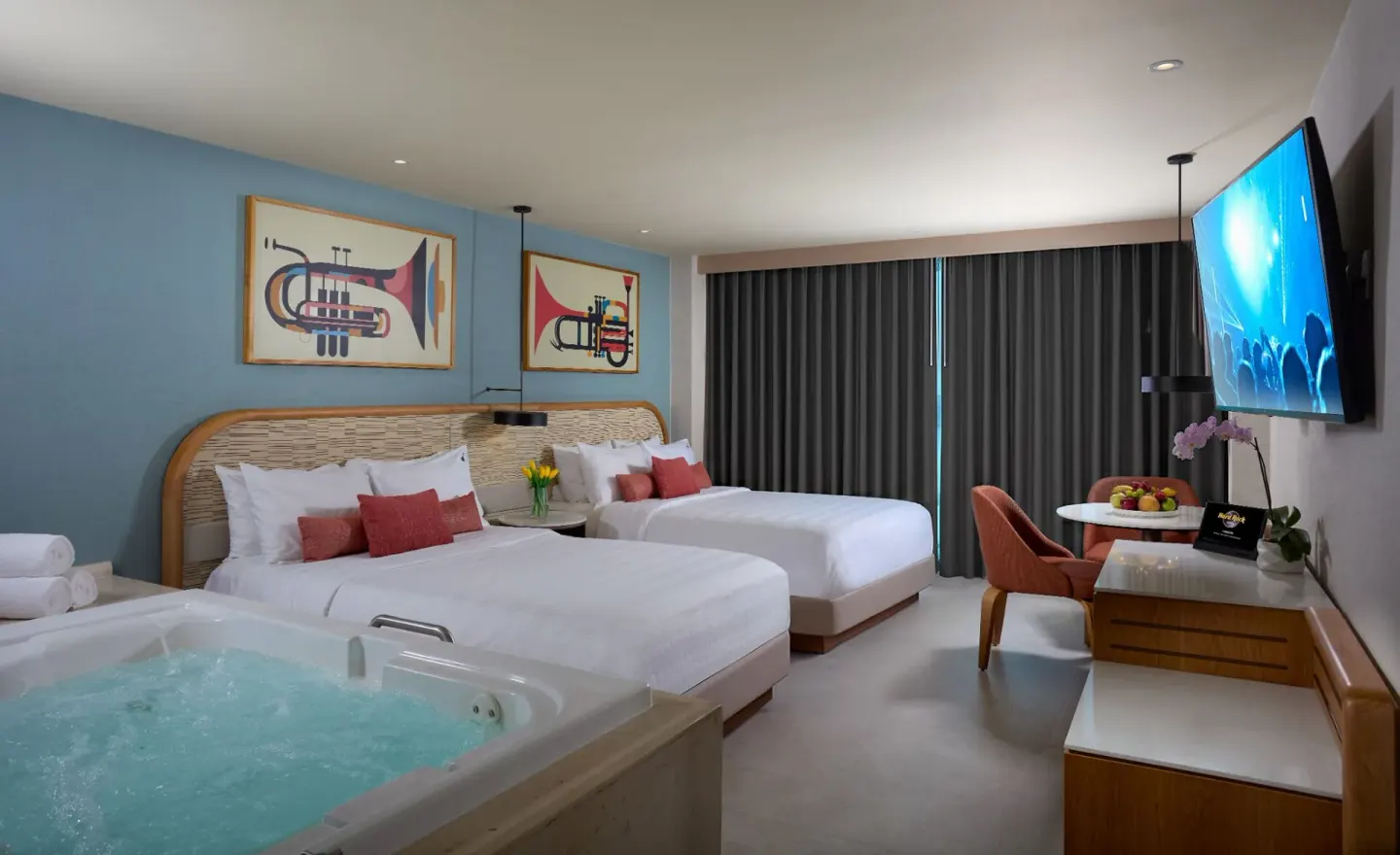 Deluxe room with two beds and an in-room tub at Hard Rock Hotel Cancun.