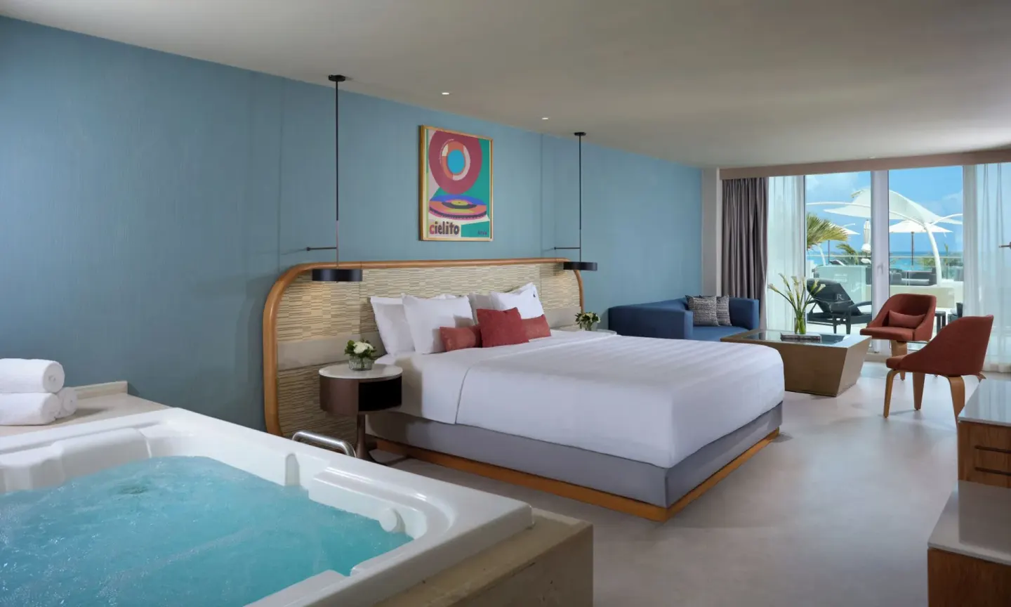 Rock Royalty Level Deluxe Ocean View room with king bed and in-room tub at Hard Rock Hotel Cancun.