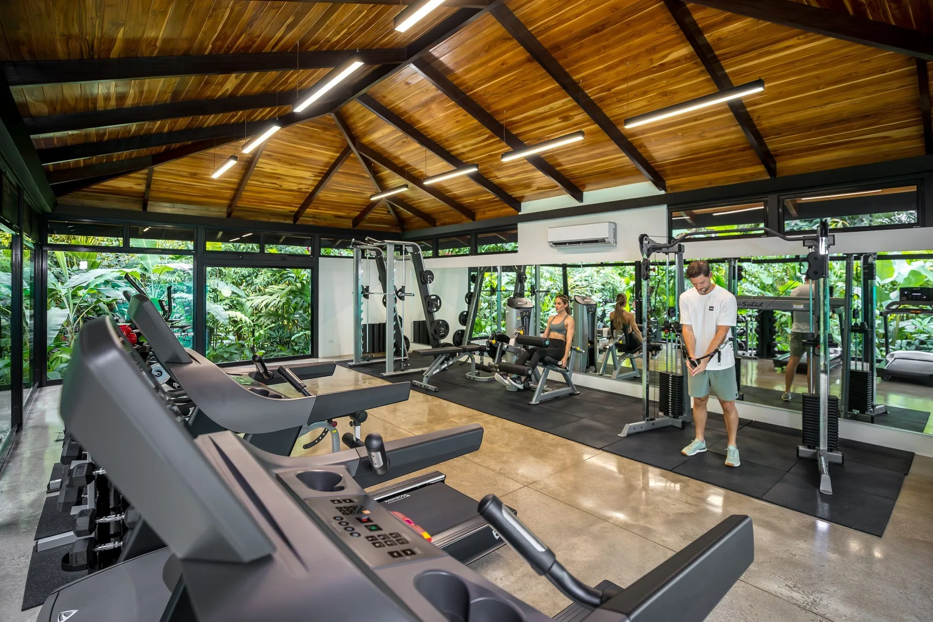 Fitness room with treadmills and weight machines at Hideaway Rio Celeste.