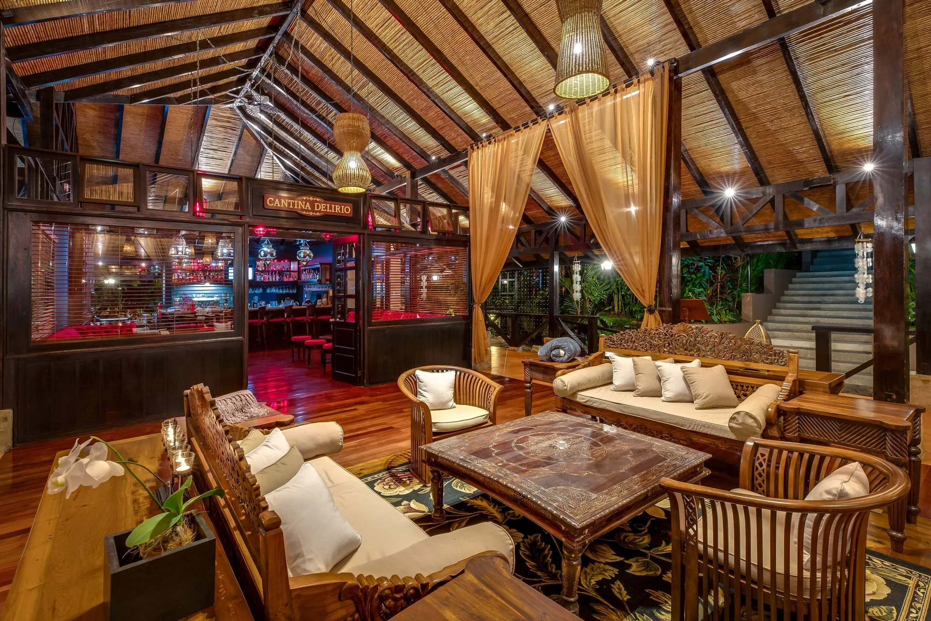 Lounge seating beside the Cantina Delirio entrance at Hideaway Rio Celeste.