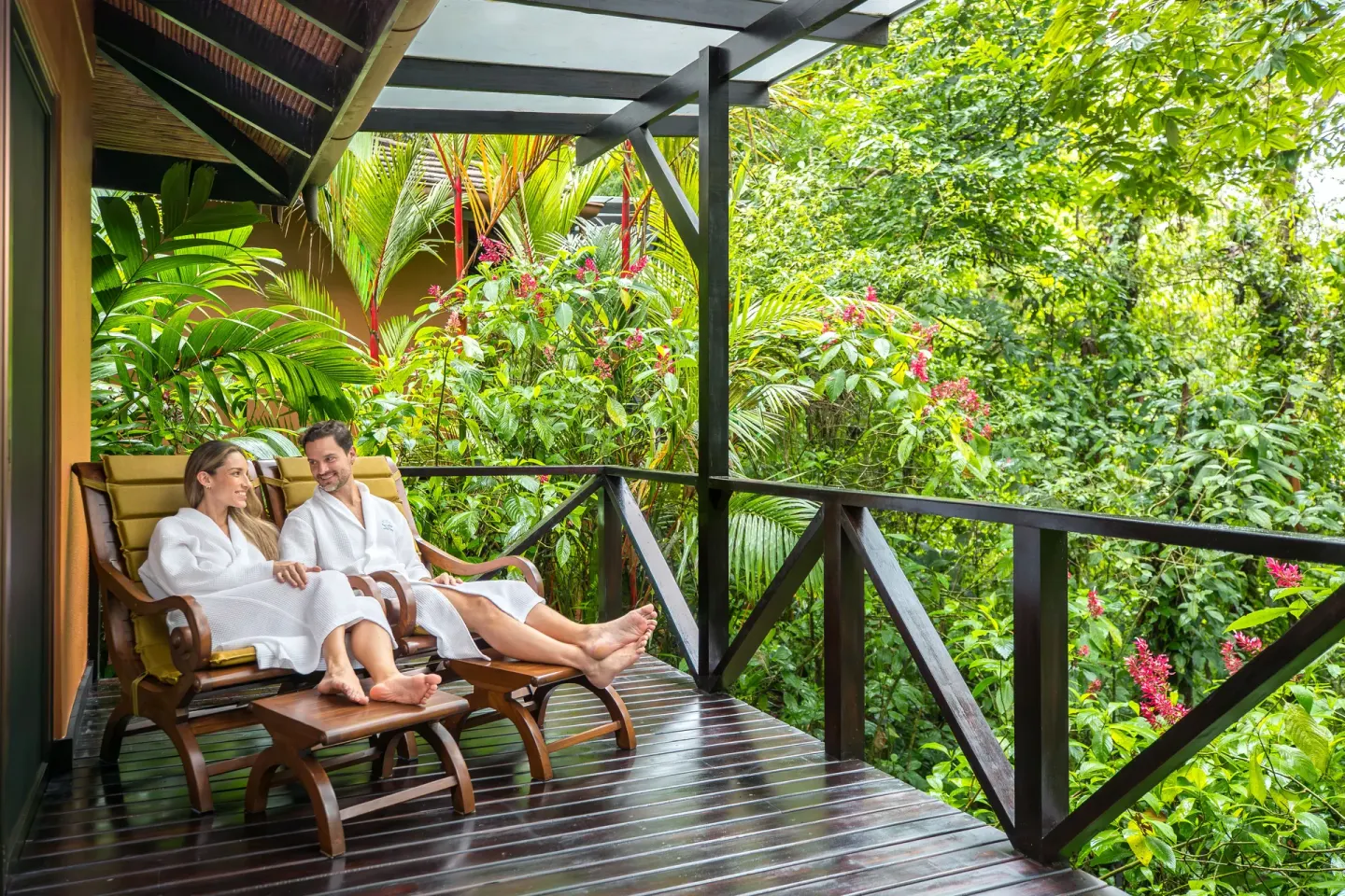 Forest View Casita balcony with lounge chairs and rainforest at Hideaway Rio Celeste.