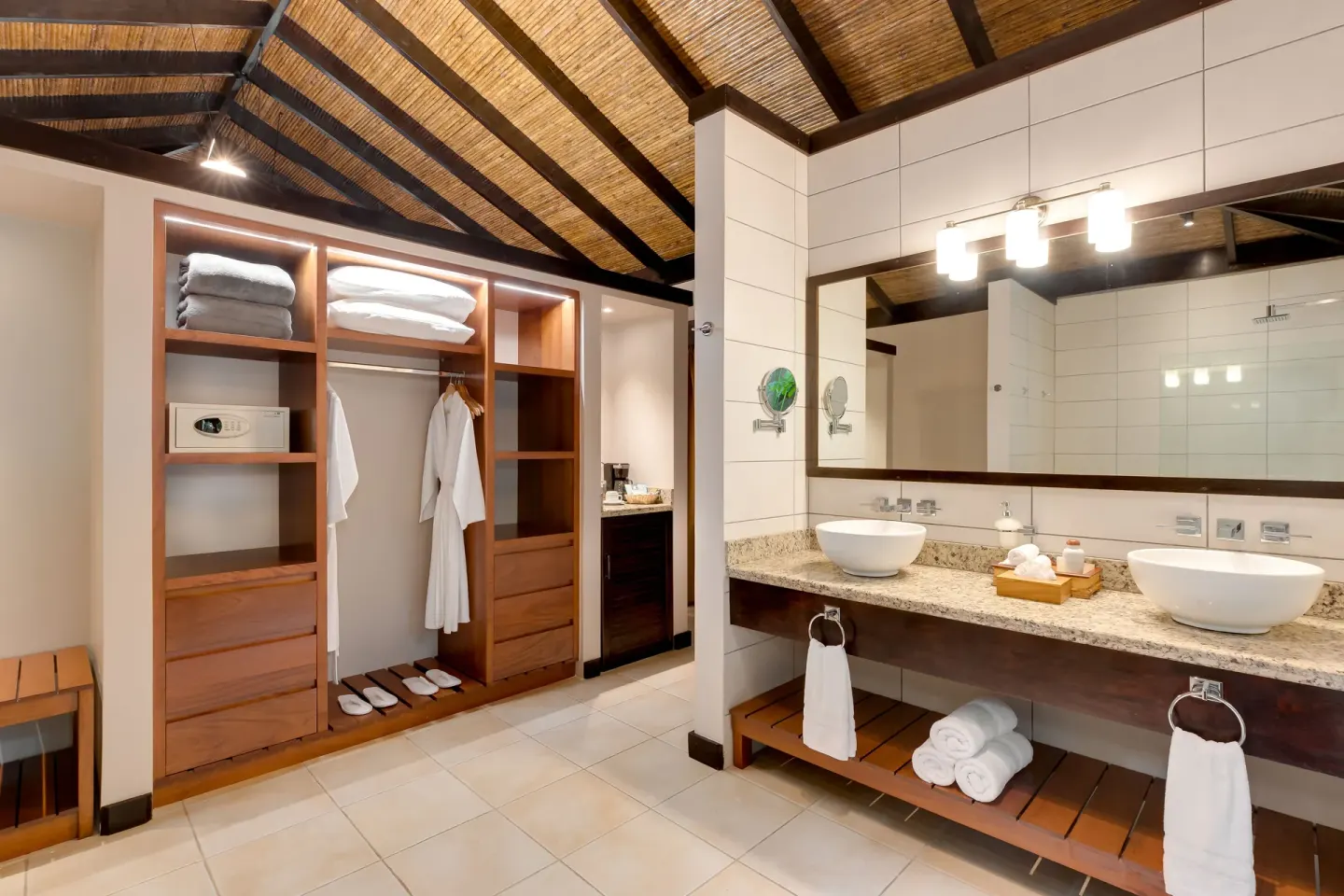 Garden View Casita bathroom with double vanity and open wardrobe at Hideaway Rio Celeste.
