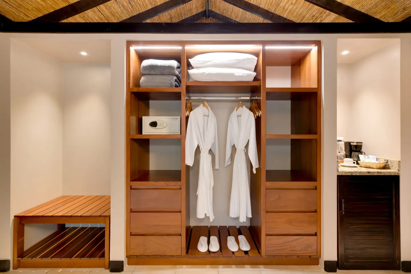 Garden View Casita at Hideaway Rio Celeste with open closet shelves, robes, slippers, safe, and coffee area.