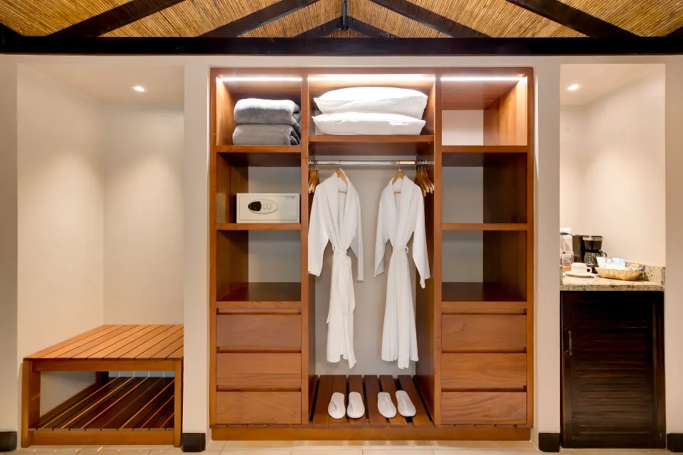Garden View Casita at Hideaway Rio Celeste with open closet shelves, robes, slippers, safe, and coffee area.
