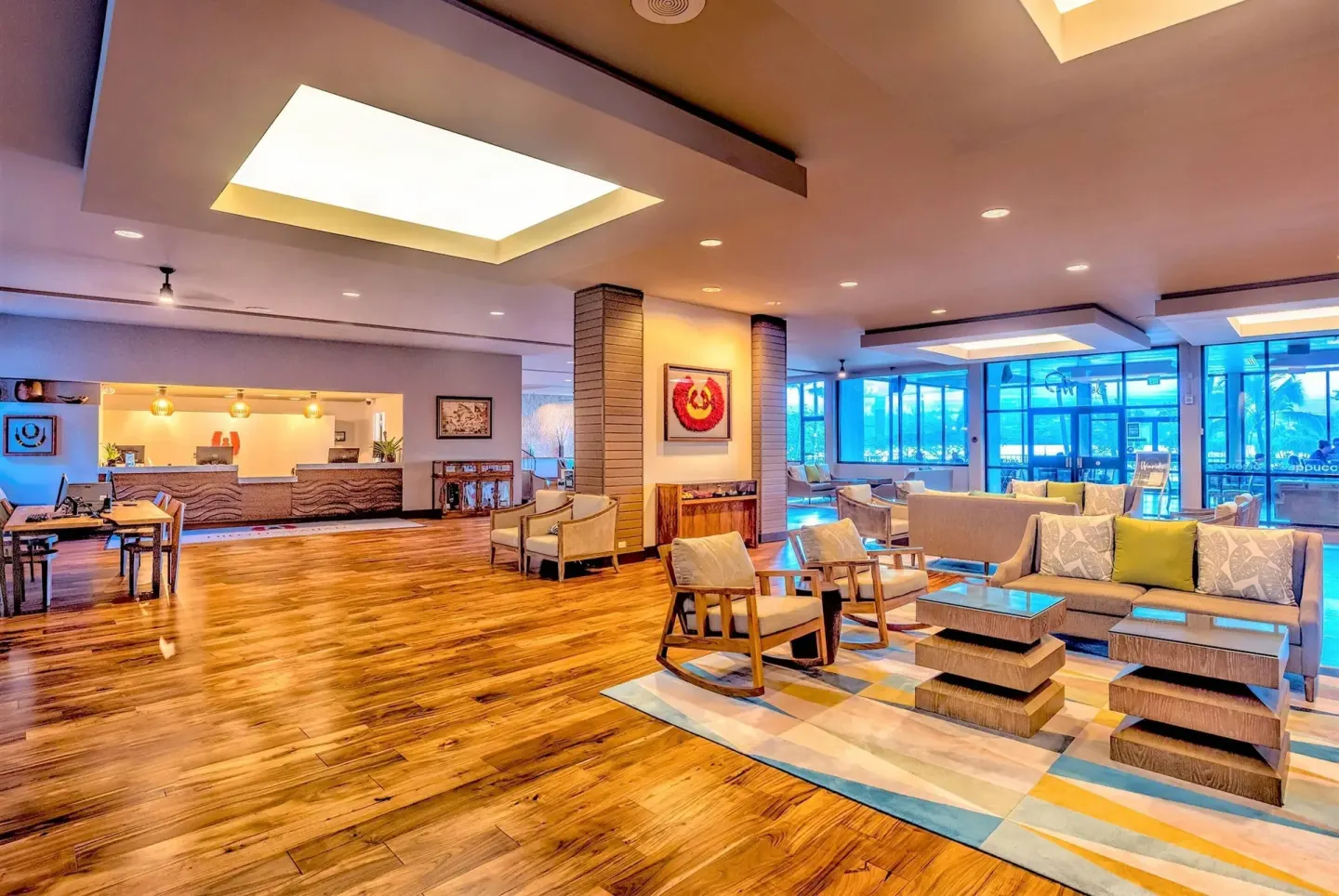 Lobby seating area and reception desk inside Hilo Hawaiian Hotel.
