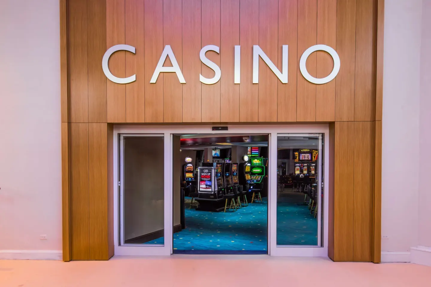 Casino entrance with slot machines inside at Hilton Aruba Caribbean Resort and Casino.