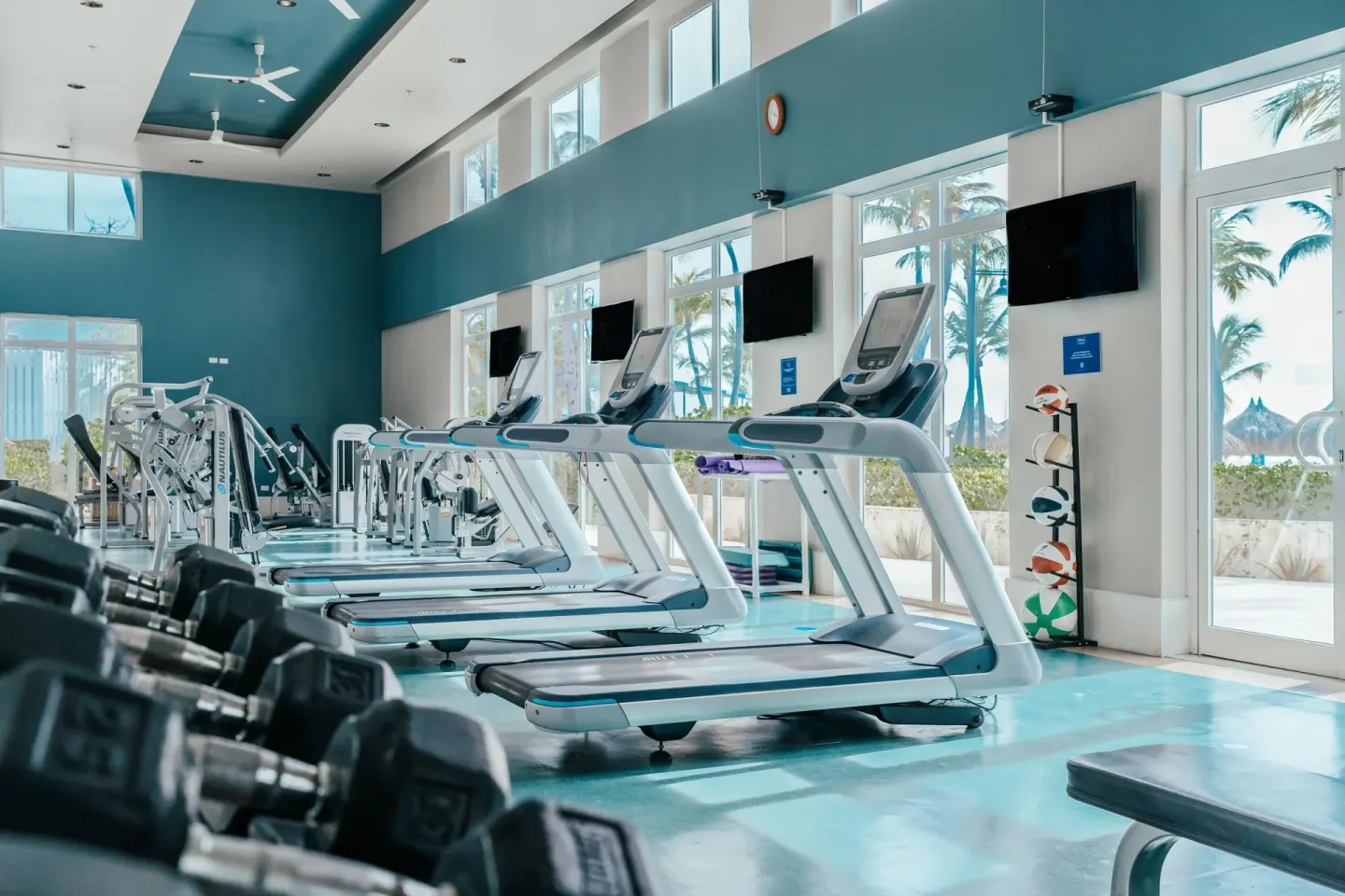 Fitness center with treadmills and weights at Hilton Aruba Caribbean Resort and Casino.
