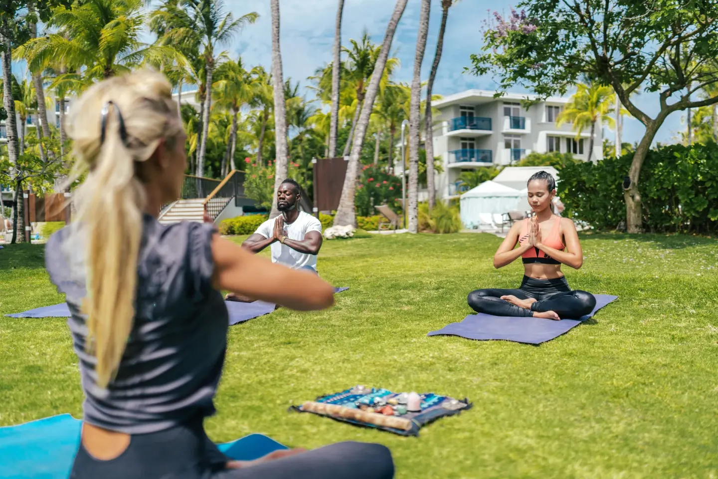 Outdoor yoga class on the lawn at Hilton Aruba Caribbean Resort and Casino.